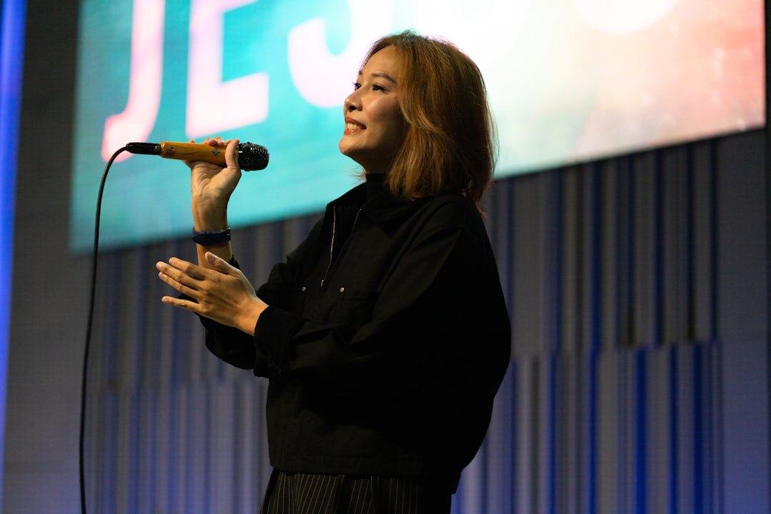 confident person speaking on stage