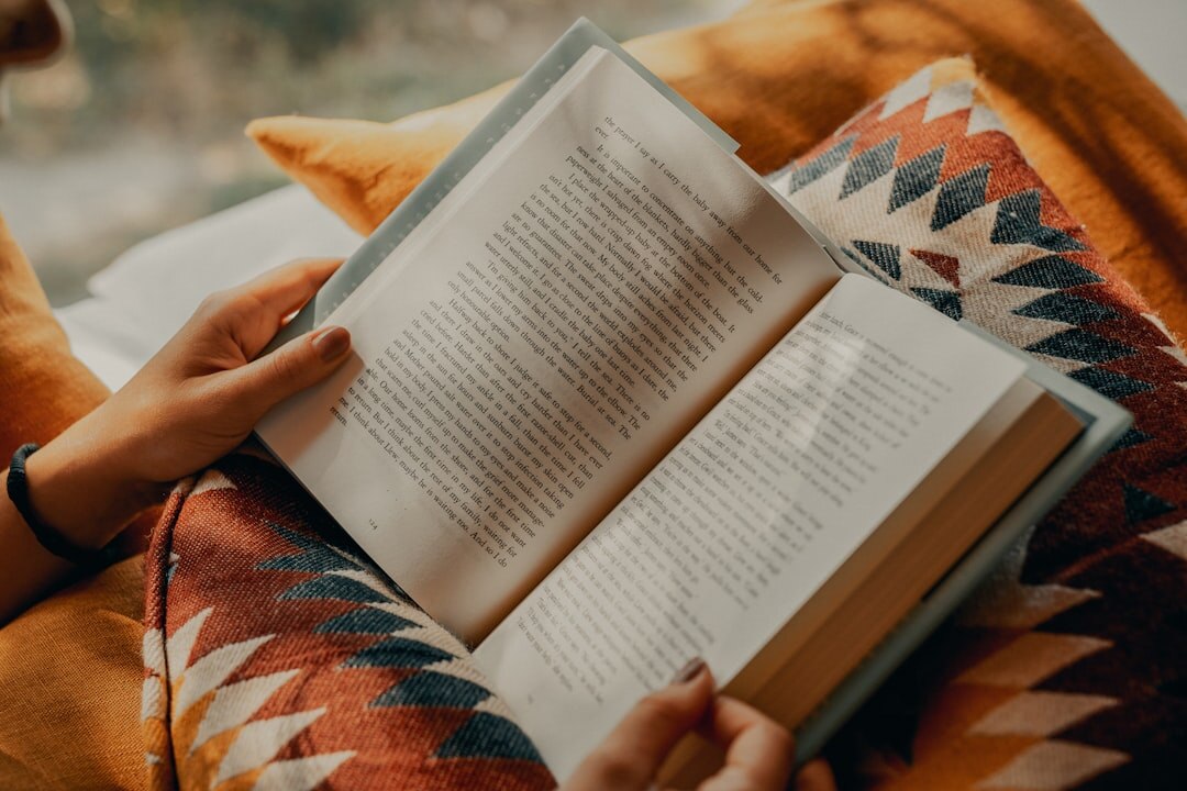 person reading book quietly